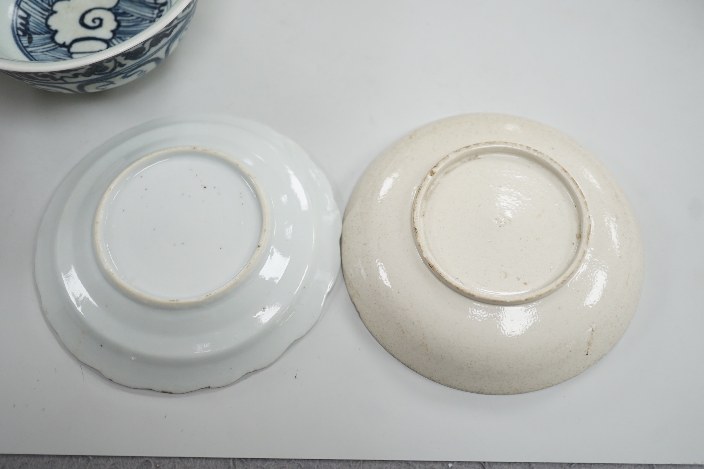 A small Chinese Ming blue and white bowl, and other, together with two small saucers (4)